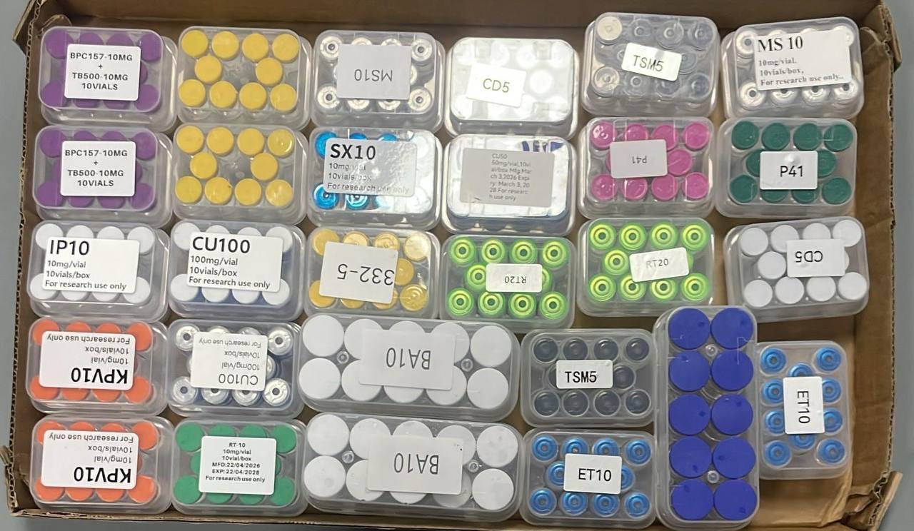 Carton containing a wide assortment of labelled wholesale product trays